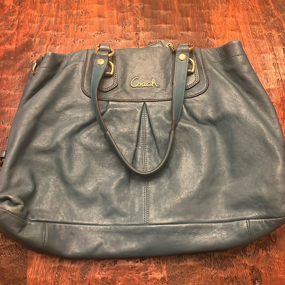 Teal Coach handbag with gold trim